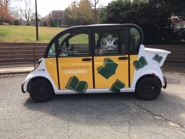 electronic golf cart with book appliqué on the side