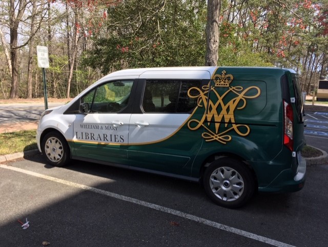 A green and white library van