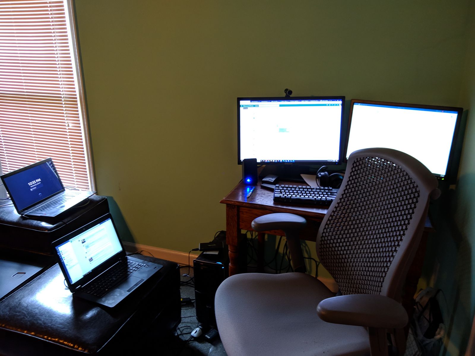 An in-home computer set up with 4 monitors 