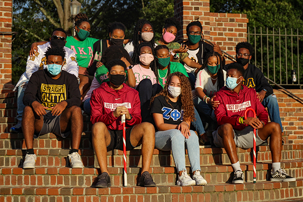 Students in William & Mary's National Pan-Hellenic Council from various Black Greek Letter Organizations pose on the Sunken Garden steps.
