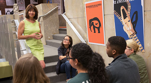 Professor Anne Marie Stock speaks with students