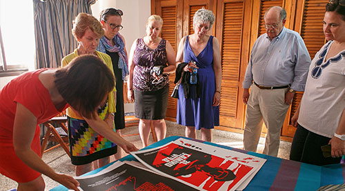 W&M Libraries board members look through a collection of Cuban film posters
