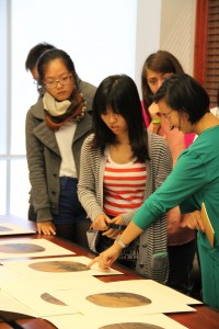 Professor Wu (right) discusses Sung dynasty paintings with her students