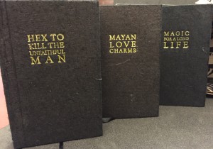The three miniature volumes from the Portable Mayan altar : pocket books of Mayan spells: Magic for a long life; Mayan love charms; Hex to kill the unfaithful man. Rare Book-Vinyard, N7433.4 .P37 P667 2007.