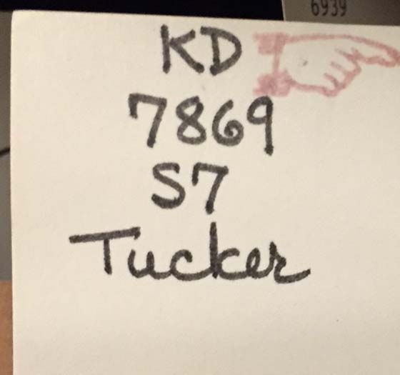 Call number tag in a Tucker Signature book showing the pointing hand.