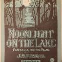 The blue and black cover of this sheet music has a picture of the moon shining across a body of water with some dark trees in the foreground. On the lower half of the page is the title "Moonlight on the Lake: Fantasia for the Piano"