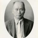 Black-and-white photographic portrait (oval-shaped on white background) of an unidentified Chinese immigration applicant.