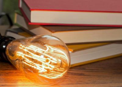 lightbulb in front of books