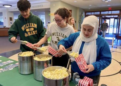 Students getting popcorn