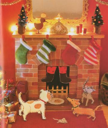 Papercut feet of Santa sticking out of a fireplace with papercut cats and dogs looking on 